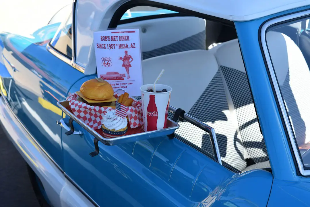 hamburger, soda, and ice cream set next to pick-up